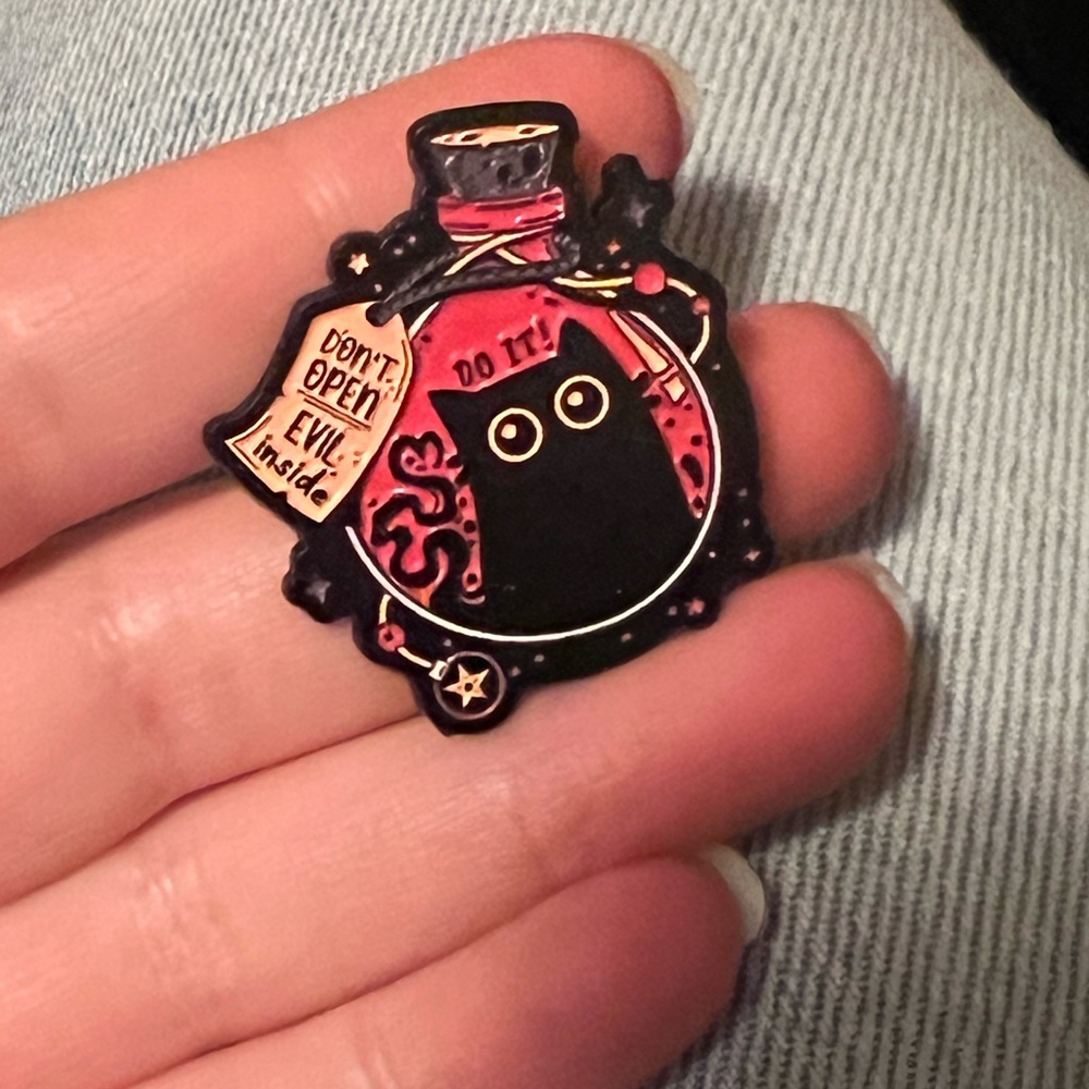 evil cat trapped in a potion bottle enamel pen
